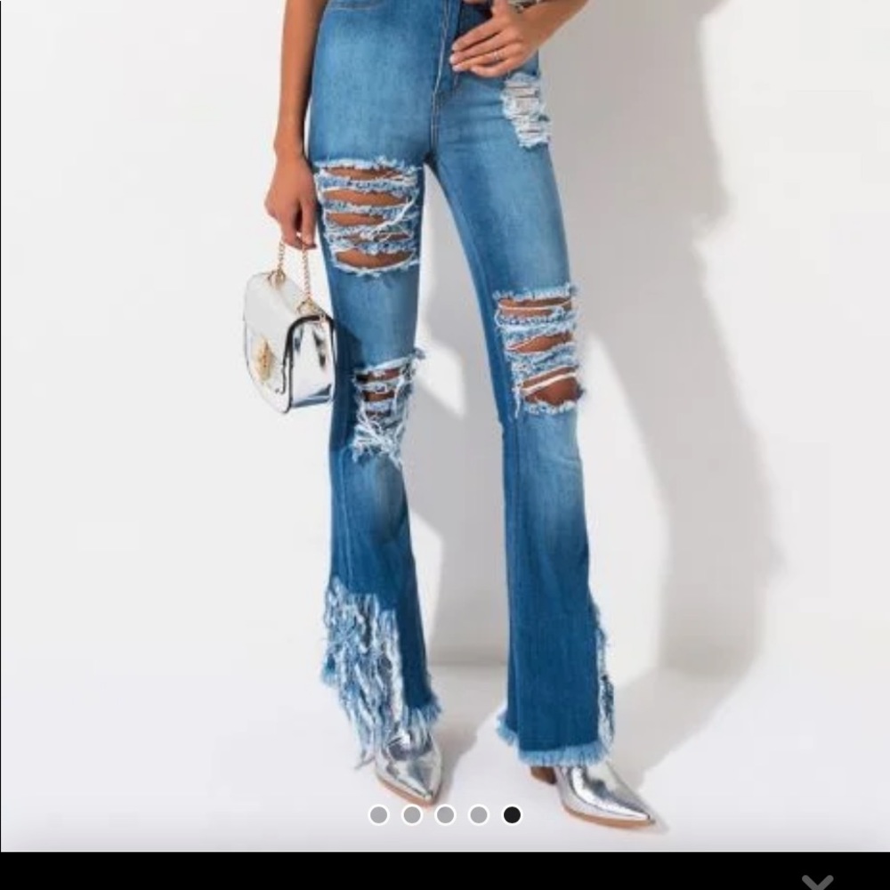 Akira Jeans distressed highrise light wash flare.
